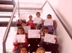 Niños y niñas con sus diplomas